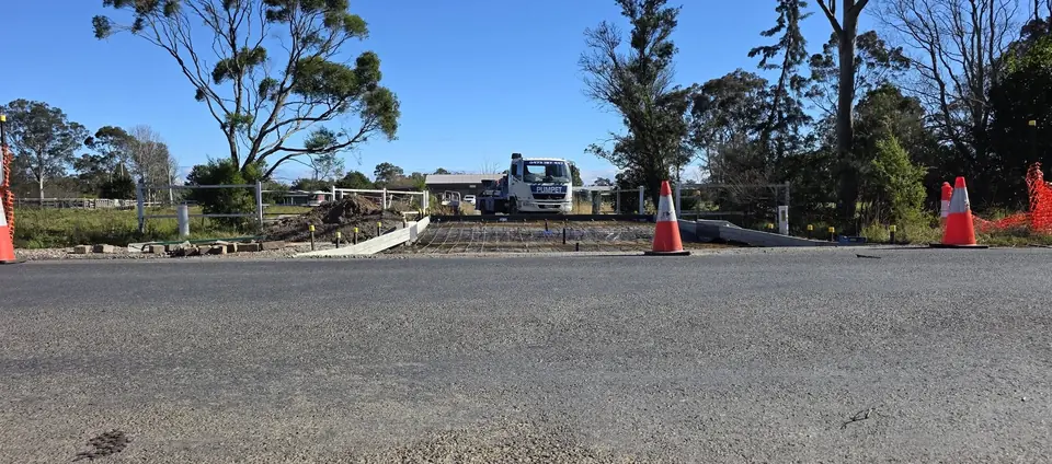 Pumpet truck parked roadside with traffic cones in place on a rural South Coast road